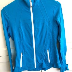 Turquoise Lululemon jacket with white zippers